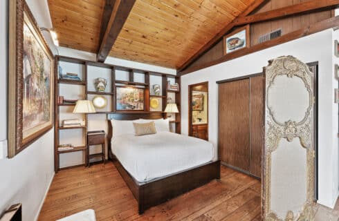 Queen size bed with room divider and closet area